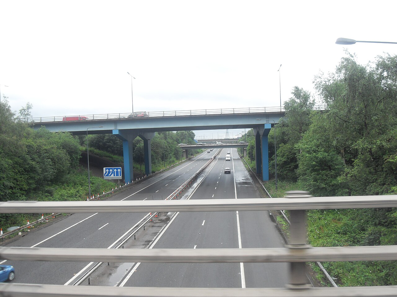 A UK motorway junction with distance signs